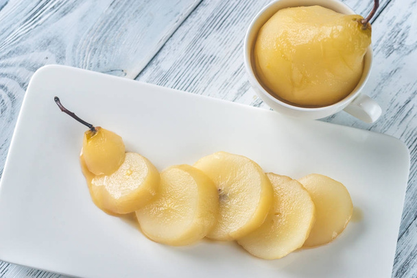 Sliced poached pear on the plate - Photo, Image