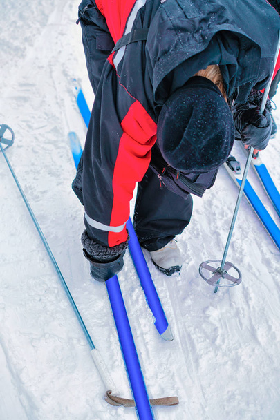 Man putting on ski at winter Rovaniemi - Photo, Image