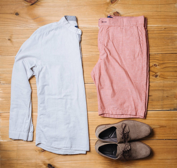Flat lay of men casual fashion outfits on wooden background, Top view - Foto, immagini