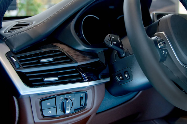Detail of the headlight button in a car. - Fotó, kép
