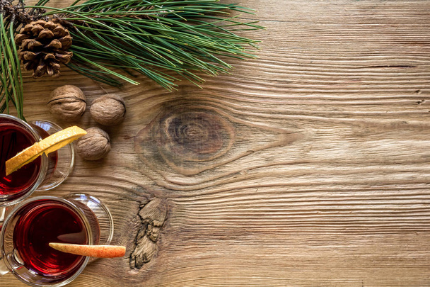 Mulled wine with spices on wooden background - Фото, зображення