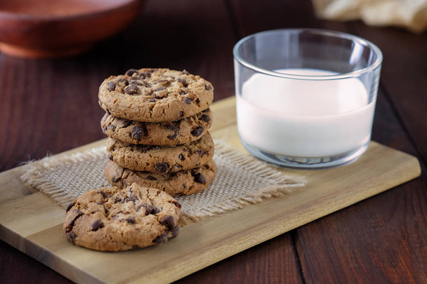 Glass of milk and chocolate chip cookies for the breakfast. - Photo, Image