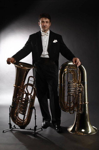 Tuba brass instrument. Classical musician portrait man horn play - Zdjęcie, obraz