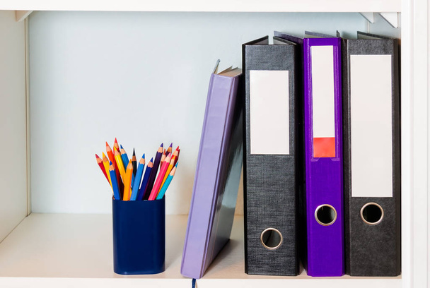 White office shelf with folders, organizer and pencil holder - Photo, Image