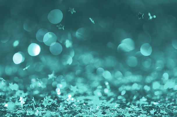 Fond festif avec confettis brillants dans des tons turquoise
  - Photo, image