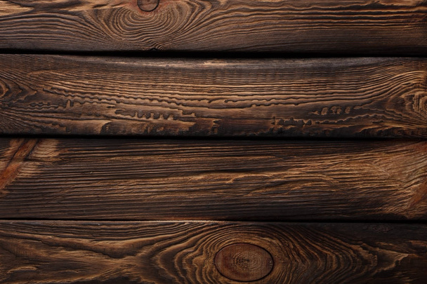 古いダークブラウンの木製のボードの質感 - 写真・画像