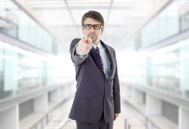 mad business man pointing, at the office - 写真・画像