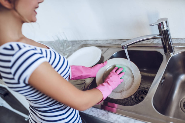 Young woman is doing cleaning at home - Foto, Bild