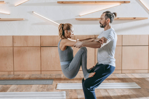 middle aged couple practicing aerobics together at training class - Foto, Imagem