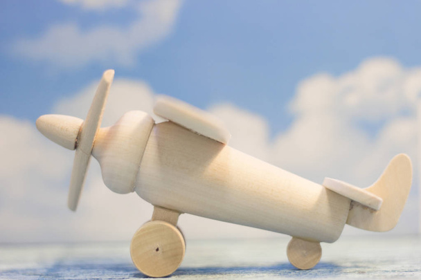 A wooden toy airplane - Foto, immagini
