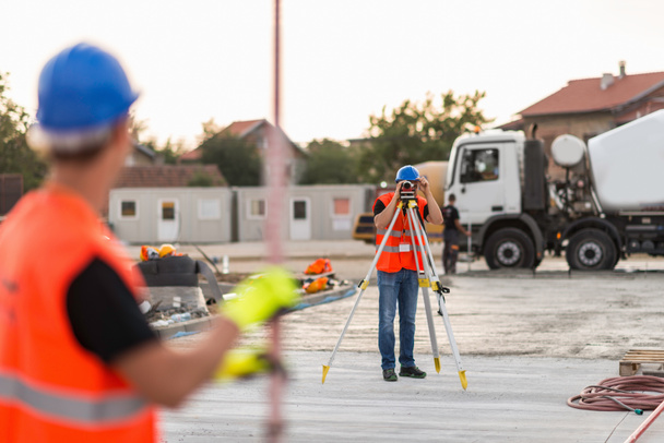 Surveyors working on construction site - Photo, Image