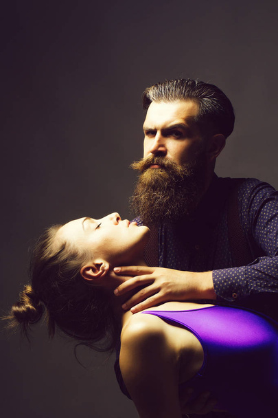 Man holds neck of woman - Valokuva, kuva