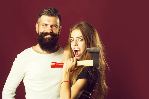 expressive couple with axe - Foto, imagen
