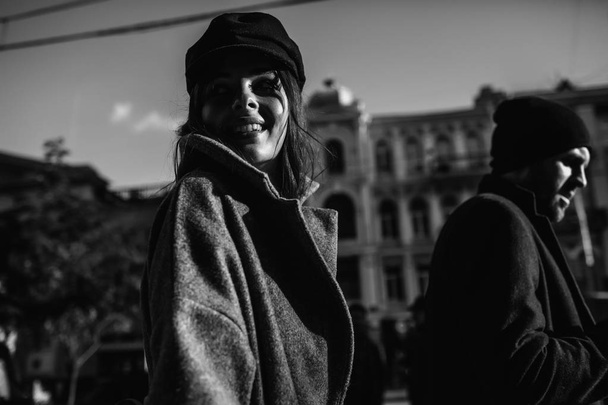 Beautiful couple in stylish clothes in gray tones, city - Valokuva, kuva