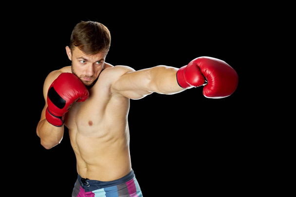 Young boxer in red gloves - Фото, зображення
