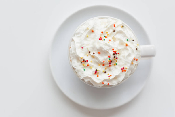 Appetizing latte with whipped cream and sprinkles - Photo, Image