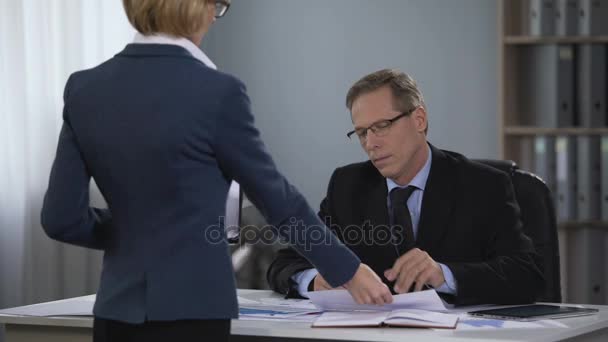 General director touching hand of secretary, offensive work environment, abuse - Felvétel, videó