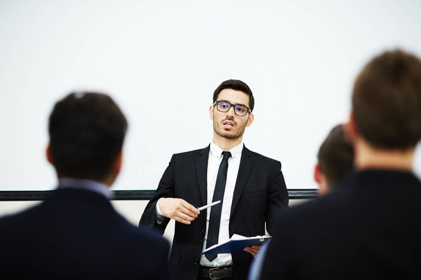 Successful entrepreneur speaking to audience at his business training - 写真・画像