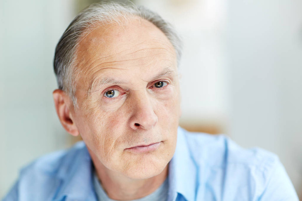 Face of mature man looking at camera with calm expression - Foto, immagini