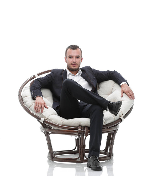 young businessman sitting in a comfortable chair - 写真・画像