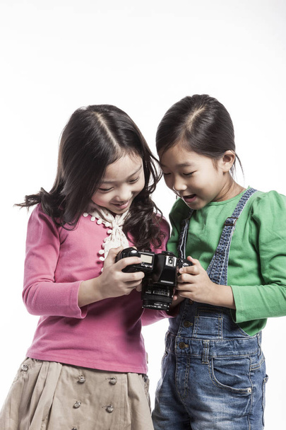 Two asian girls take pictures and play. - Photo, Image