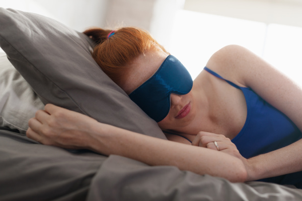 Woman In Bed Sleeping With Sleep Mask On Eyes - Photo, Image