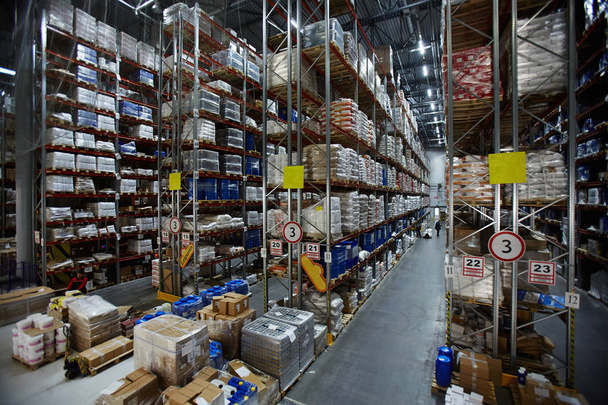 Modern warehouse with lots of packed goods on shelves - Photo, Image