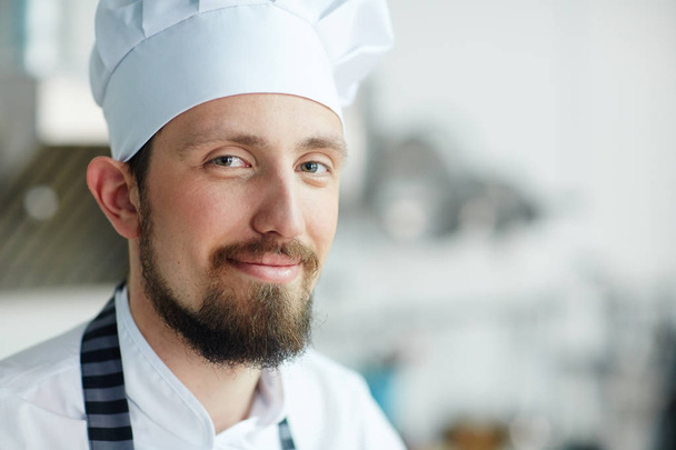 Handsome chef or baker looking at camera - Foto, Bild