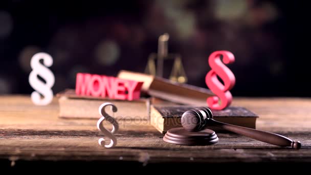 Law and justice concept. Law symbols on wooden table and bokeh background. Dolly shot. - Footage, Video
