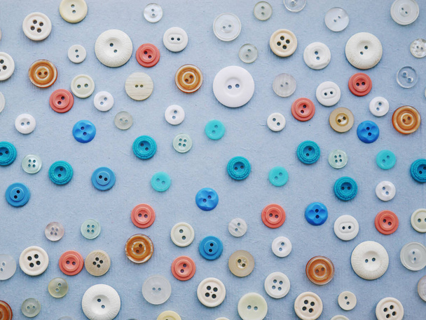 Composition with different colorful buttons on grey surface - 写真・画像