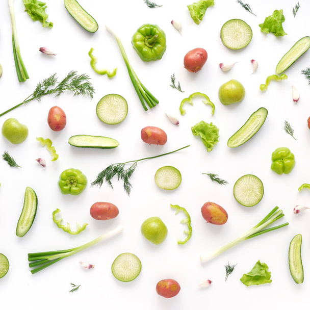 Food composition with potatoes, zucchini, cucumbers, peppers, green onions, garlic and dill isolated on white background - Φωτογραφία, εικόνα