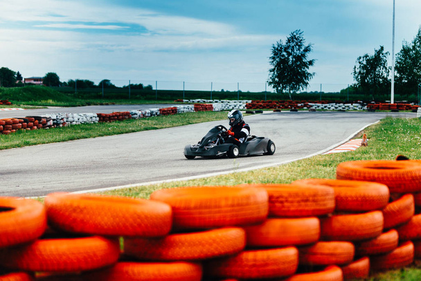 Woman driving go-cart on a sports track - Photo, Image
