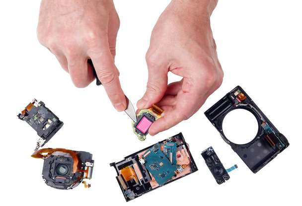 Unprofessional repair of a photo camera with a kitchen knife and - Photo, Image
