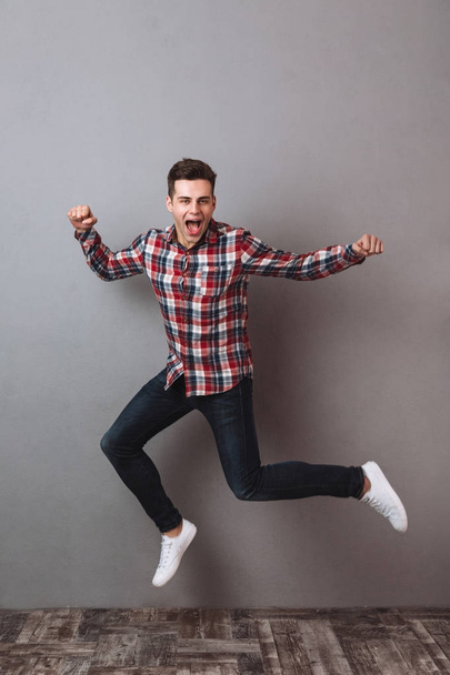 Full length image of Screaming man in shirt and jeans - Zdjęcie, obraz