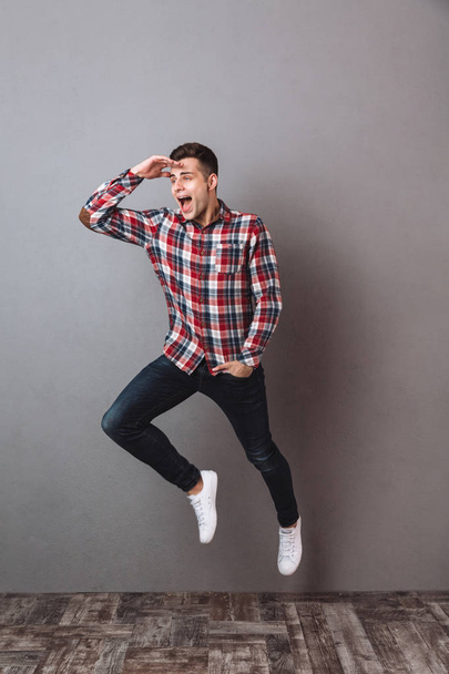 Full length image of Happy man in shirt and jeans - Zdjęcie, obraz