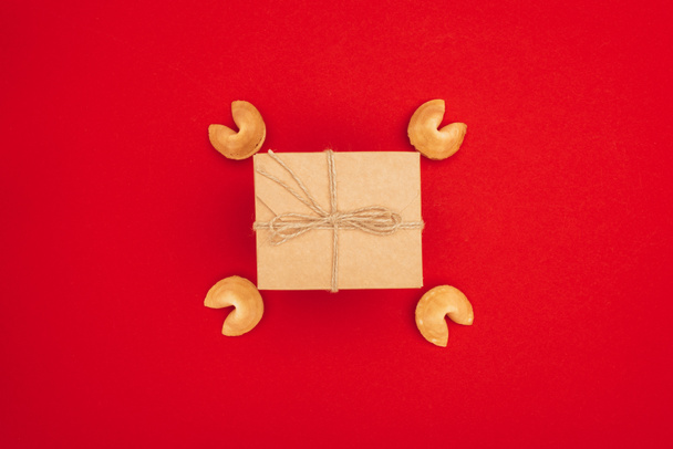 top view of delicious chinese fortune cookies and box wrapped in kraft paper, Chinese New Year concept - Photo, Image
