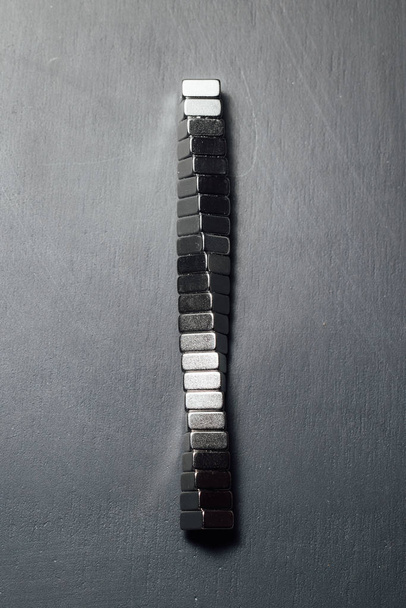 neodymium magnets spiral, black background - Photo, Image