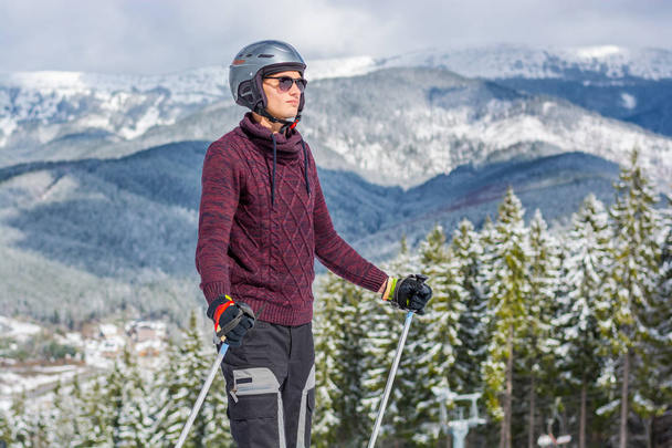 Skier in glasses and a helmet riding a mountain - Photo, Image