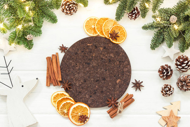 Orange, cinnamon sticks, anise, and fir branches. Christmas motive. Top view, copy space - 写真・画像
