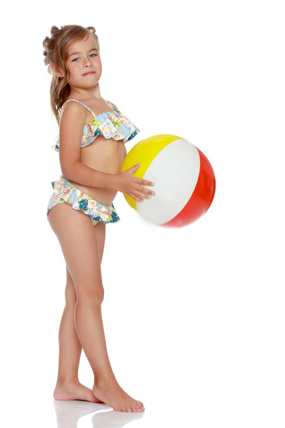 Little girl in a swimsuit with a ball - Fotoğraf, Görsel