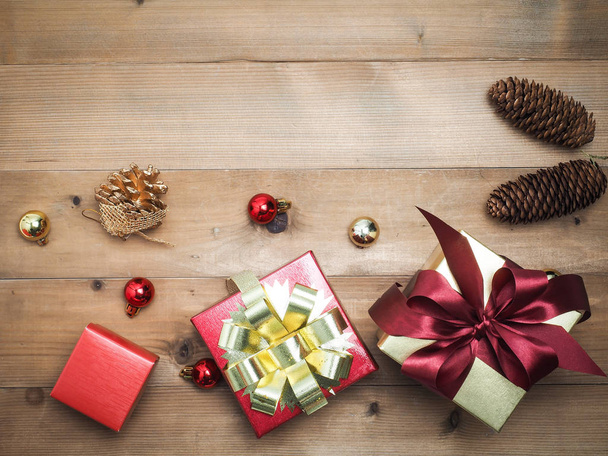 Christmas decorations, giftbox wooden background. Empty space for designer text. - Φωτογραφία, εικόνα