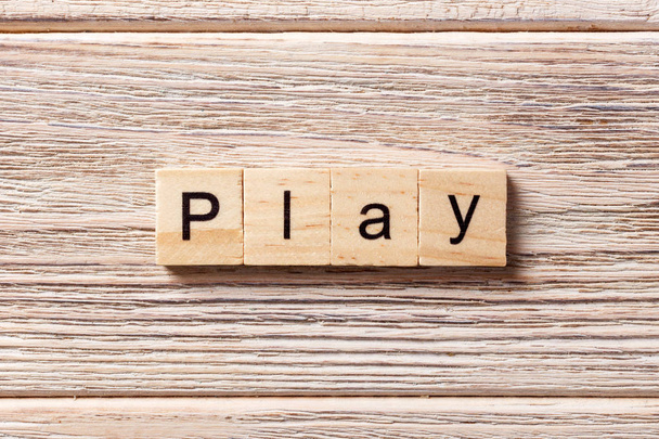 play word written on wood block. play text on table, concept - Photo, Image