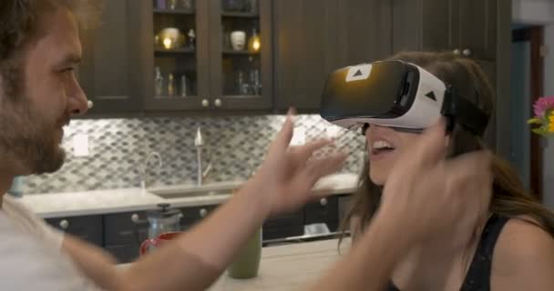 Man puts VR headset on woman and she touches him - Footage, Video