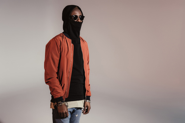 Stylish young african american man wearing hood with face mask - Fotoğraf, Görsel