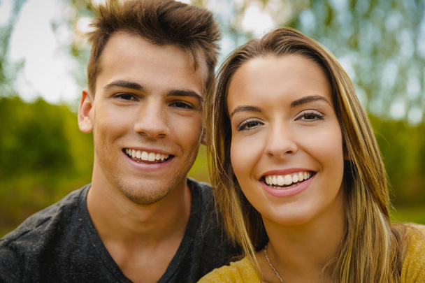 young beautiful couple smiling - 写真・画像