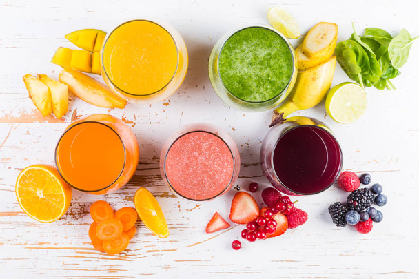 Selection of colourful smoothies on rustic wood background - Foto, immagini