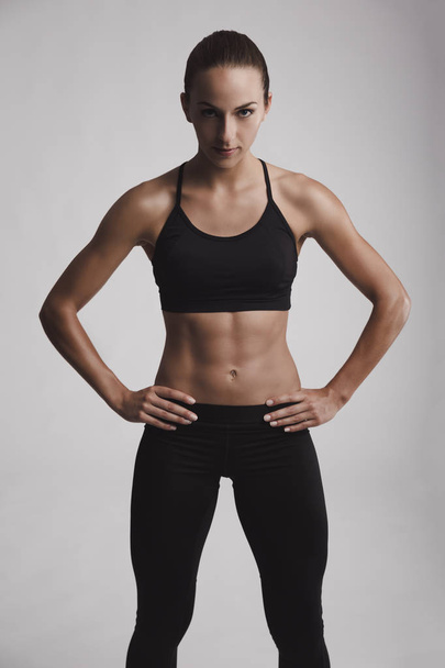 young woman with muscular body - Φωτογραφία, εικόνα