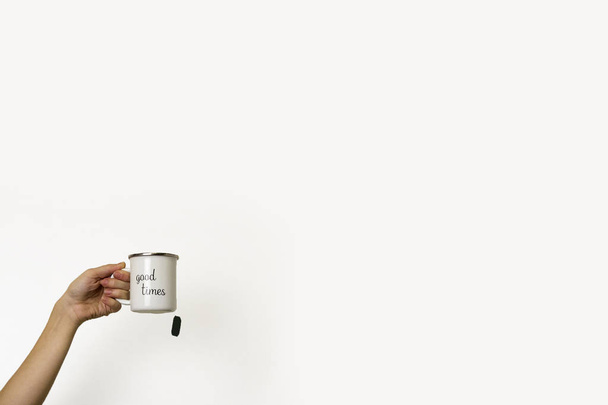 a female hand holds a mug with the inscription "Good things"  - Fotó, kép