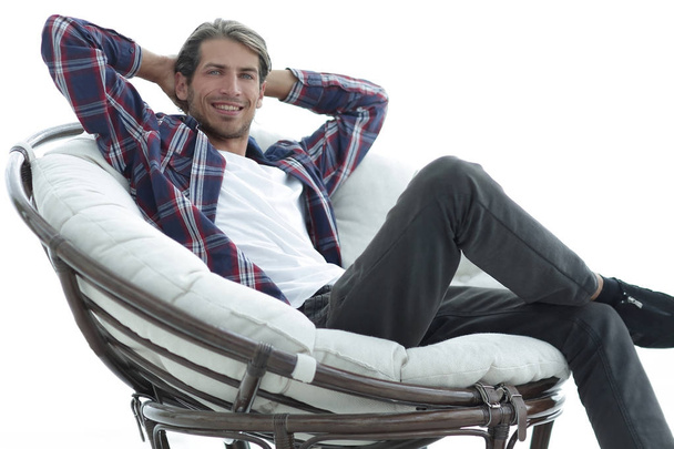 close-up. a successful guy sitting in a large round comfortable chair - Fotoğraf, Görsel