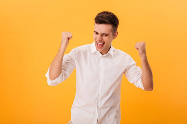 Picture of Happy man in shirt rejoice with open mouth - Фото, зображення